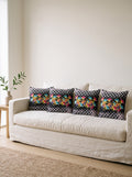 Dama Checkerboard Floral set of 4 cushion covers – four cushions on a sofa
