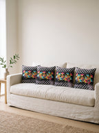 Dama Checkerboard Floral set of 4 cushion covers – four cushions on a sofa