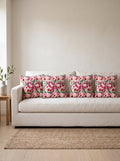 Fiora Bow & Floral set of 4 cushion covers – four cushions on a sofa