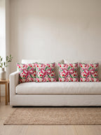 Fiora Bow & Floral set of 4 cushion covers – four cushions on a sofa