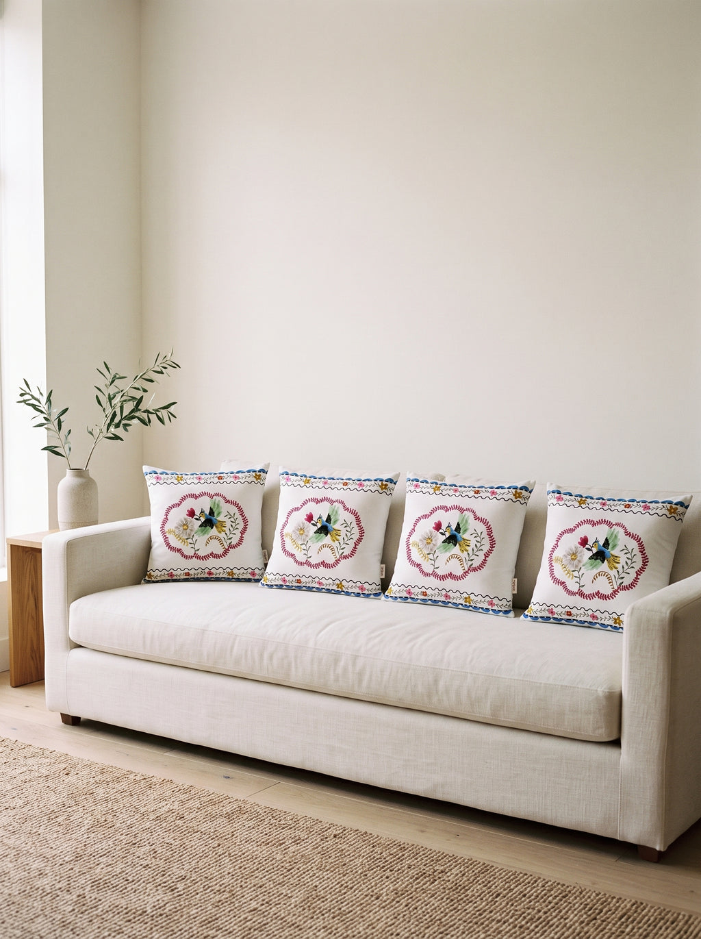Mila Bird & Floral set of 4 cushion covers – four cushions on a sofa