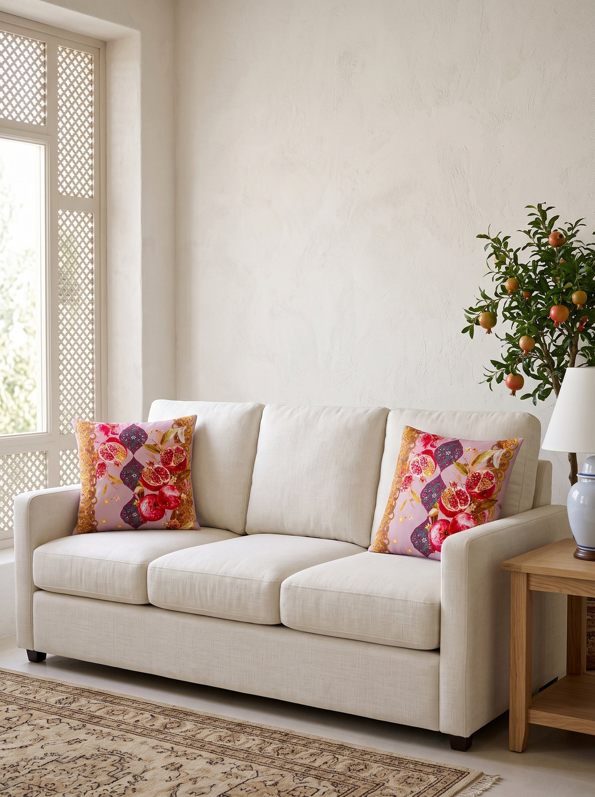 Mona Pomegranate & Gold Border set of 2 cushion covers – two cushions on a sofa