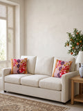 Mona Pomegranate & Gold Border set of 2 cushion covers – two cushions on a sofa