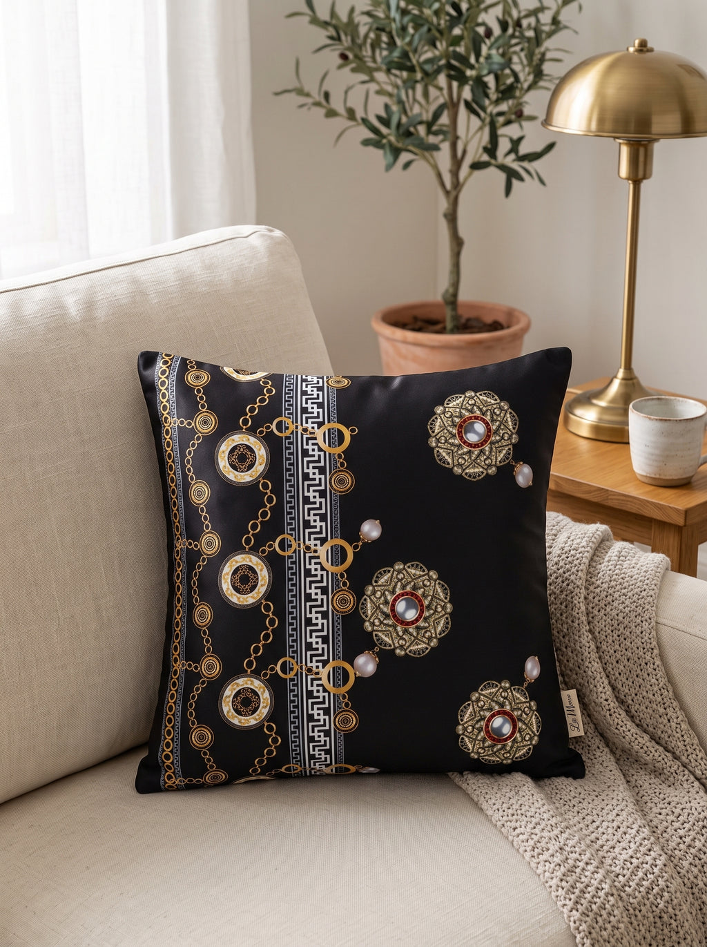 Noir Black & Gold set of 2 cushion covers – close-up on a sofa