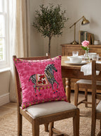 Pink Zebra set of 2 cushion covers – in a living room