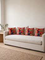 Rio Peacock & Fruit set of 4 cushion covers – four cushions on a sofa