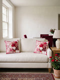 Ruby Flower Bouquet & Pomegranate set of 2 cushion covers – two cushions on a sofa